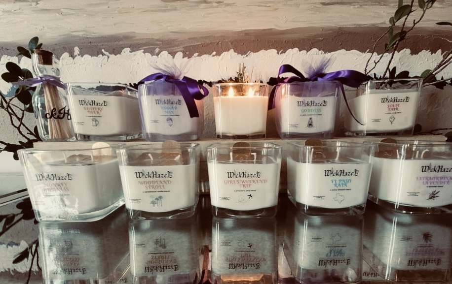 A display of Wick Hazel candles arranged on glass shelves